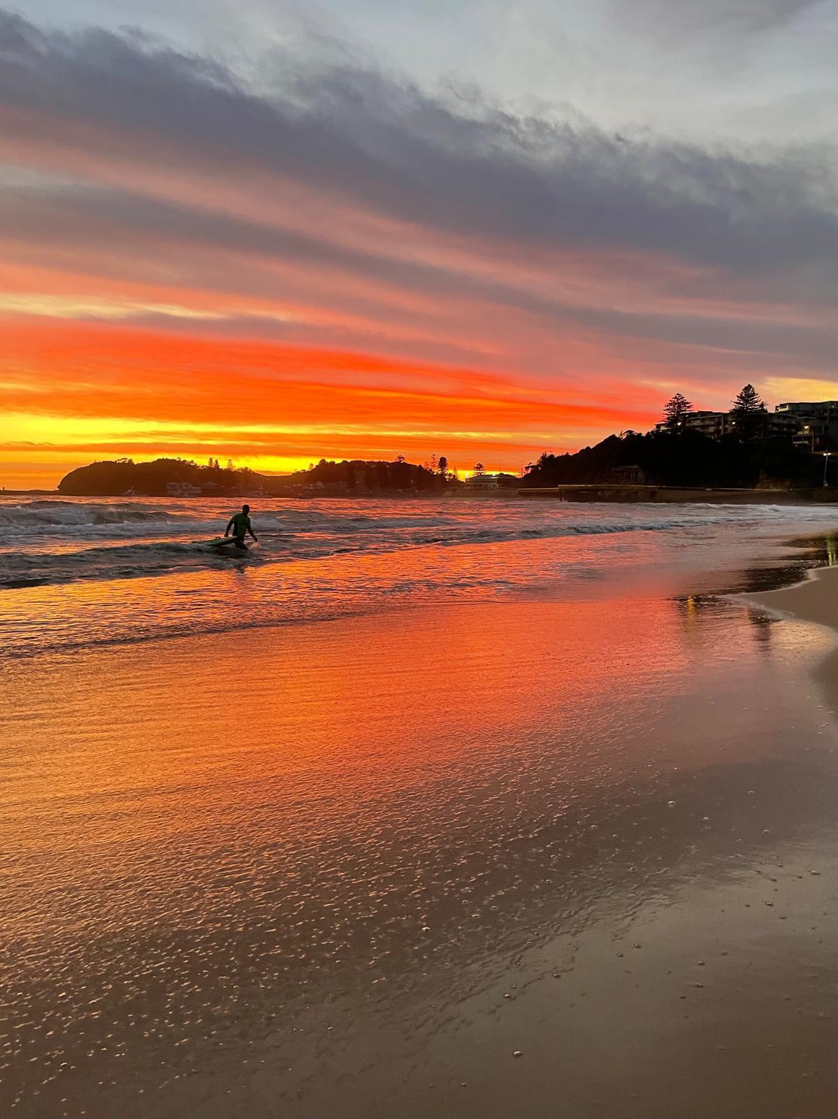 Person on the beach at sunrise on the Central Coast NSW